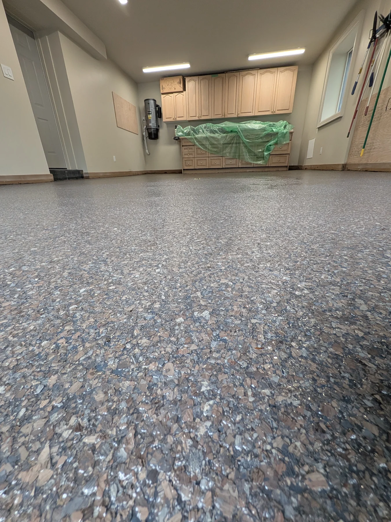 Close view of a finished decorative flake garage floor